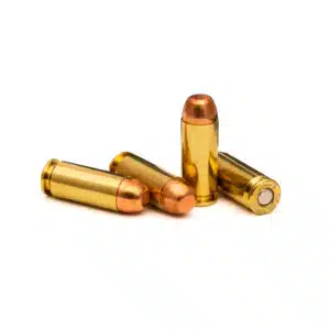 Four rounds of10mm Auto 180 gr full-metal-jacket (FMJ) cartridges lying next to each other, showcasing brass casings and round-nose bullets, on a neutral background