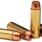 Four rounds of 500 Auto Max loaded with 350 grain XTP hollow points for hunting or target use on a white background.