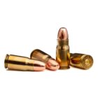 Four rounds of 8x22mm Nambu 83gr FMJ cartridges displayed on a white background
