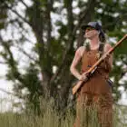 Women having rifle in her hands