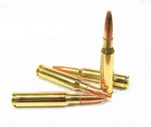 Four 6.5x52 Carcano 139gr Full Metal Jacket cartridges with brass cases lined side by side — 6.5x52 Carcano FMJ ammo for target shooting and historic Carcano rifles