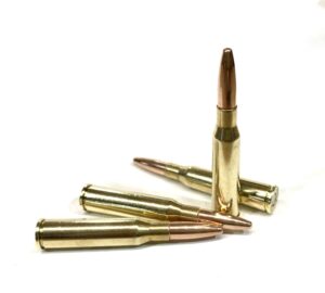 Four 6.5x50 Arisaka 140gr FMJ cartridges displayed in a row, ammunition designed for Japanese Arisaka rifles