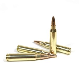 Four .223 Remington Match Grade 68gr BTHP cartridges standing upright in a staggered row on a white background