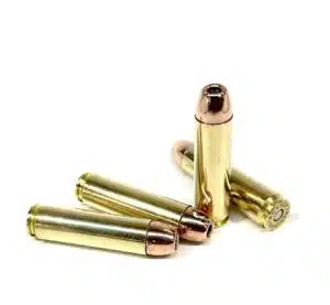 Four 240gr JHP 450 Bushmaster cartridges arranged on a white background – traditional hunting ammo for deer-sized game.