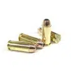 Four 10mm Auto 180gr jacketed hollow point cartridges standing upright on a white background — premium self-defense 10mm JHP ammo engineered for controlled expansion and deep penetration
