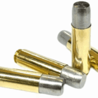 Four rounds of 12.7x42 ammo loaded with massive 700 grain hard cast bullets on a white background