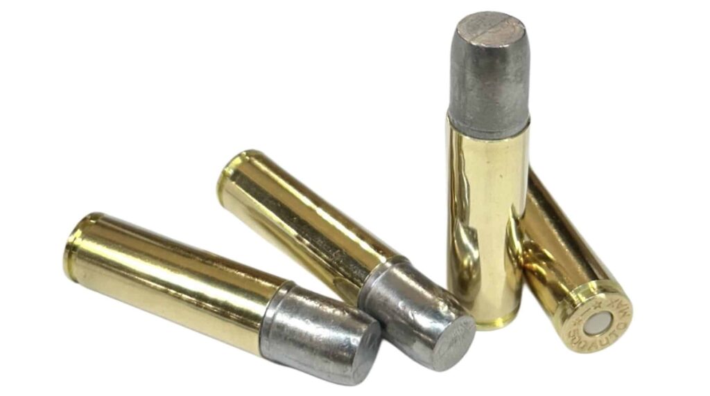 Four .500 Auto Max 700gr hard cast “Omega” LFNGC cartridges on display — heavy flat nose gas check rounds built for maximum penetration and stopping power.