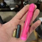 Size comparison of 777gr Lucky Ram bullet with 9mm cartridge and pink highlighter—showcasing extreme length and mass of subsonic 45-70 projectile