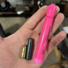 Size comparison of 777gr Lucky Ram bullet with 9mm cartridge and pink highlighter—showcasing extreme length and mass of subsonic 45-70 projectile