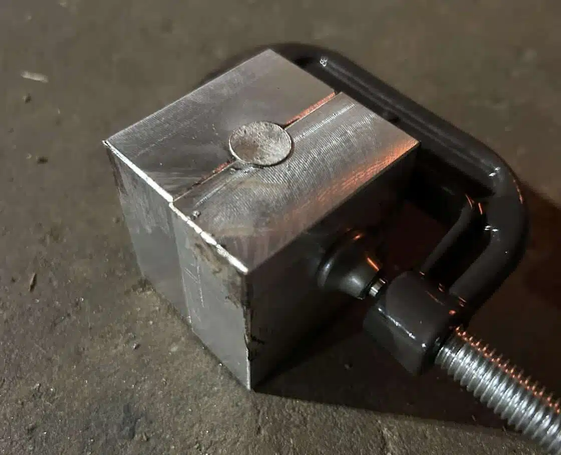 Crude prototype mold for 777gr Lucky Ram bullet—aluminum block clamped for casting trials in early development phase