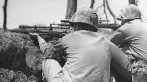 There are two Marine M1903 rifles fitted with Unertl riflescopes in this photo from Okinawa in May 1945. Source: American Rifleman[