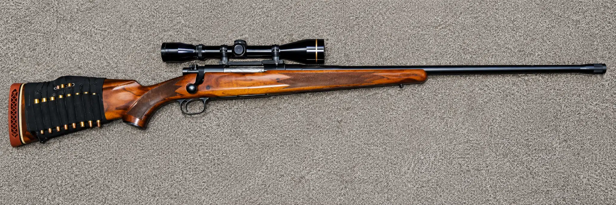 Winchester Model 70 with rifle scope, 24-inch (61 cm) barrel, and one-piece scope mount