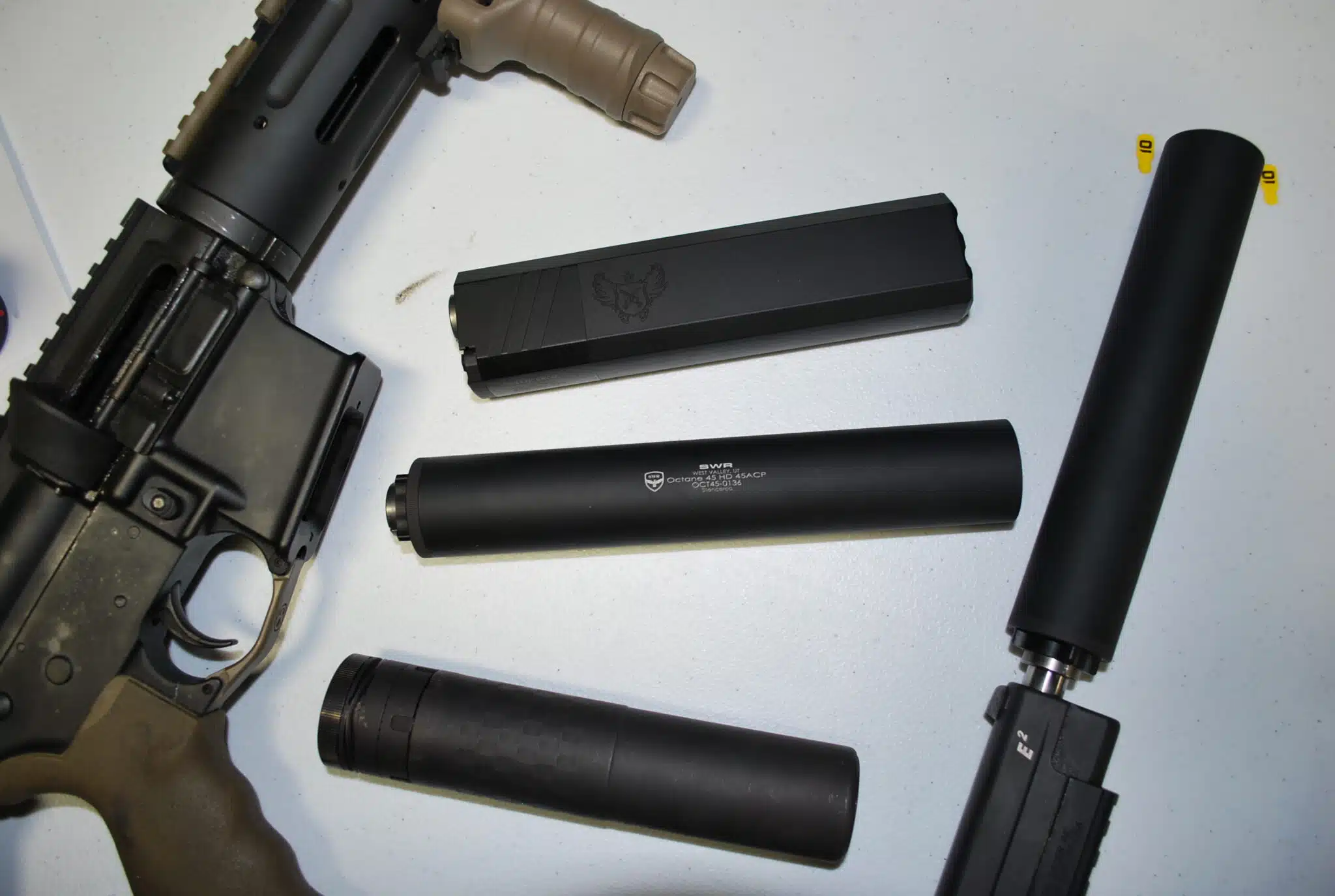 Firearm suppressors including the SilencerCo Osprey 9, SWR Octane 45, and SilencerCo Saker 5.56